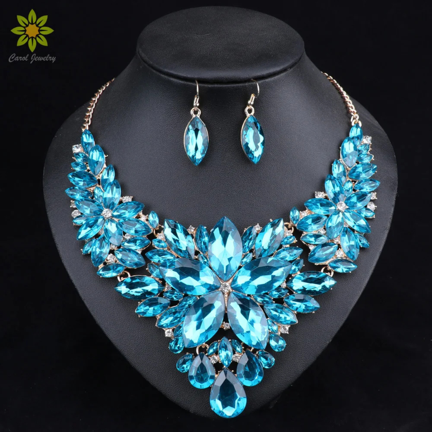 Elegant blue crystal bridal jewelry set featuring floral statement necklace and matching earrings, perfect for weddings, engagements, and formal occasions
