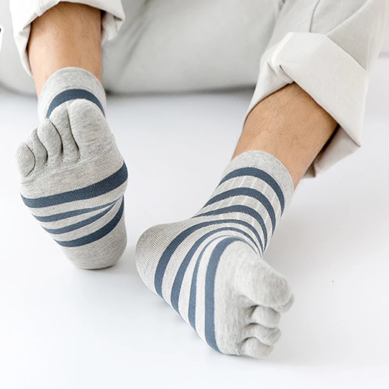 Close up of men wearing grey striped five finger cotton socks breathable casual toe socks crew length soft comfortable fit