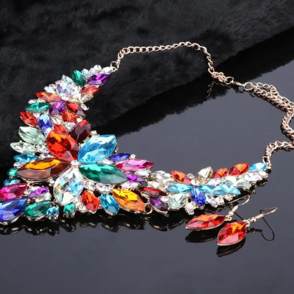 Elegant multicolor crystal bridal jewelry set with floral statement necklace and matching earrings on gold chain, perfect for weddings and special occasions