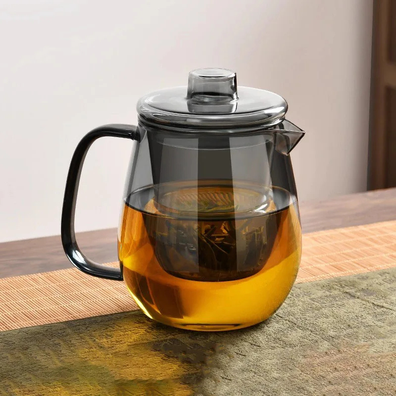 Smoked borosilicate glass teapot with removable infuser brewing loose leaf tea, heat-resistant stovetop safe tea kettle